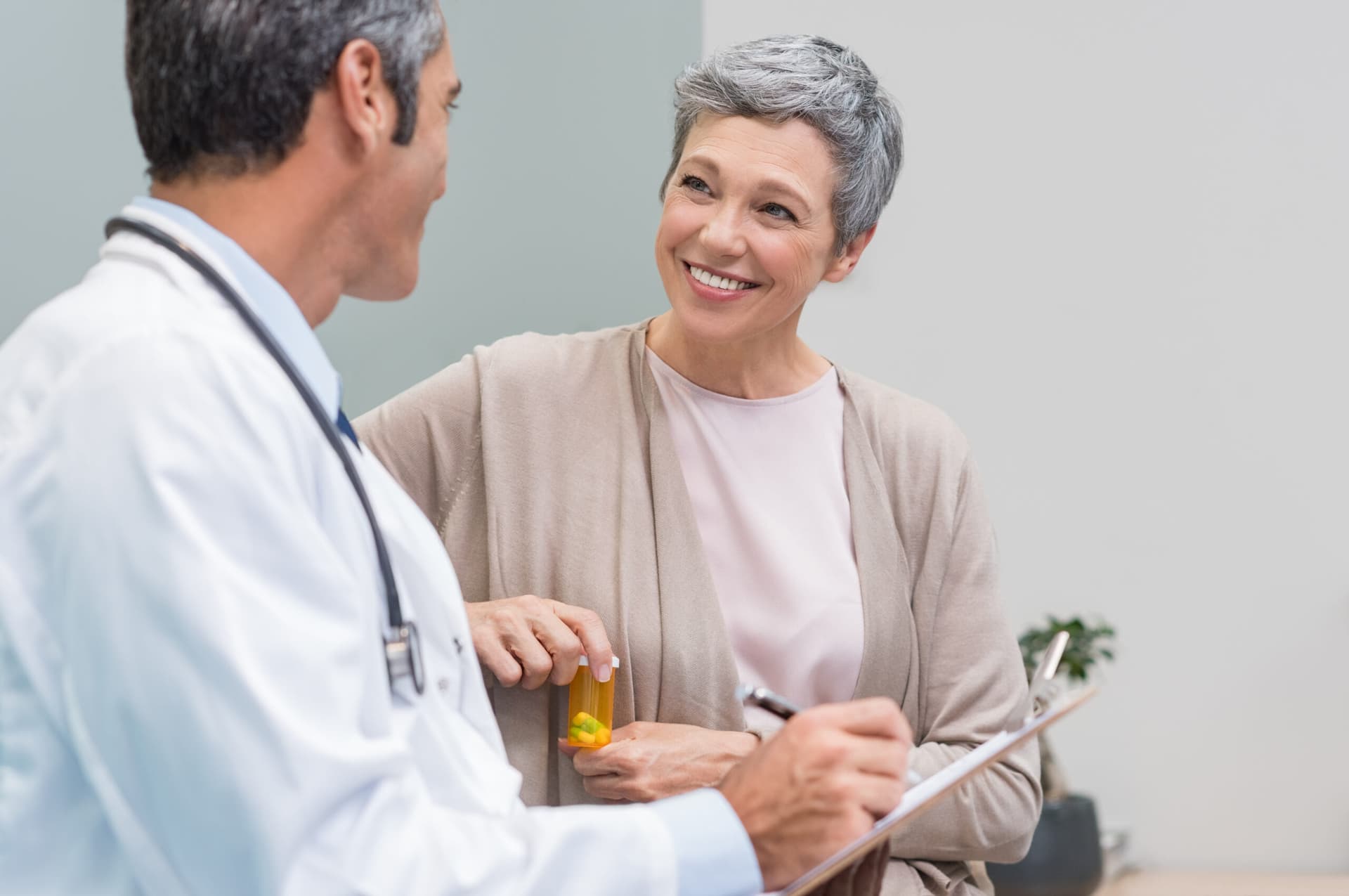 A doctor reviewing medications with a patient